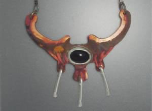 fire patina copper pendant with black onyx stone and silver dangles